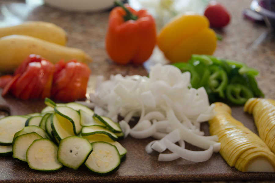 a collection of vegetables on a cutting board