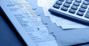 IRS tax documents and a calculator