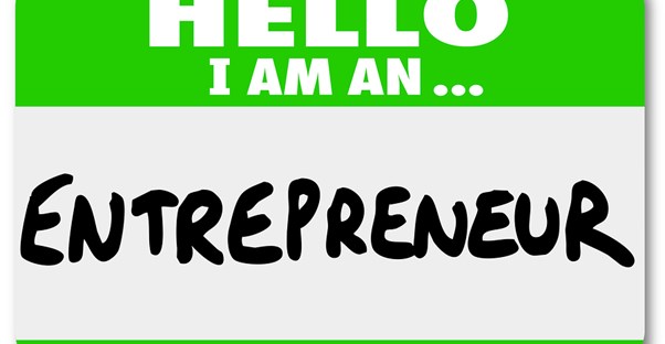 a name tag says entrepreneur on it