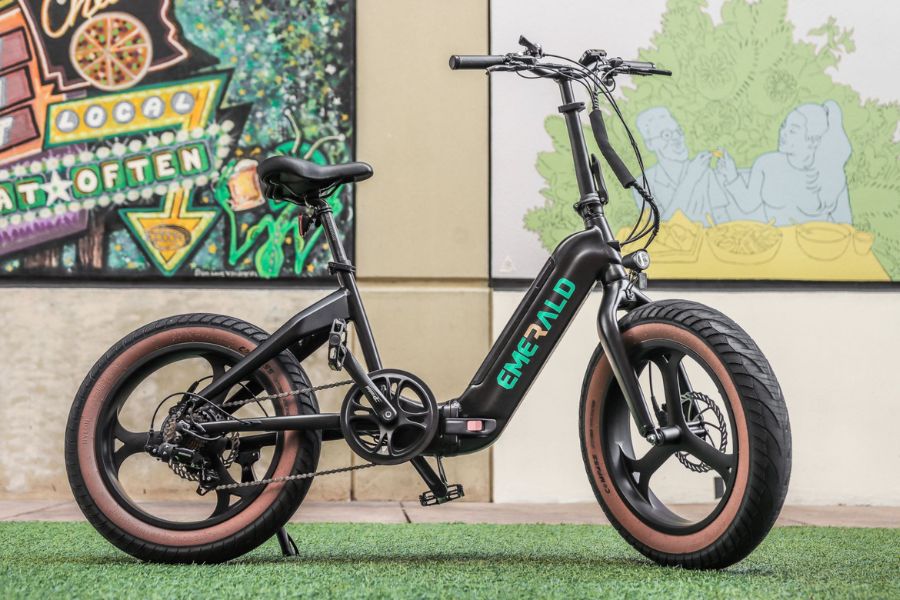 Emerald Ebike parked in front of decorative wall
